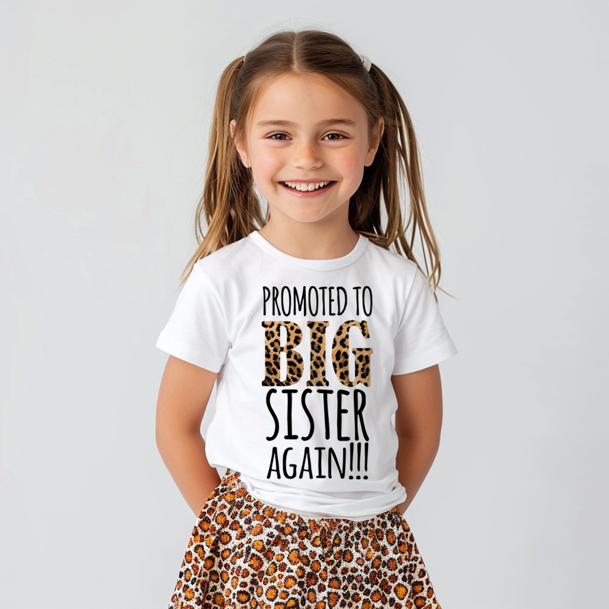 Trendy Tykes The t-shirt's message is playful and proud, perfect for a girl who's already a big sister and is stepping into the role once more. The leopard print letters add a stylish touch that's likely to be a hit!