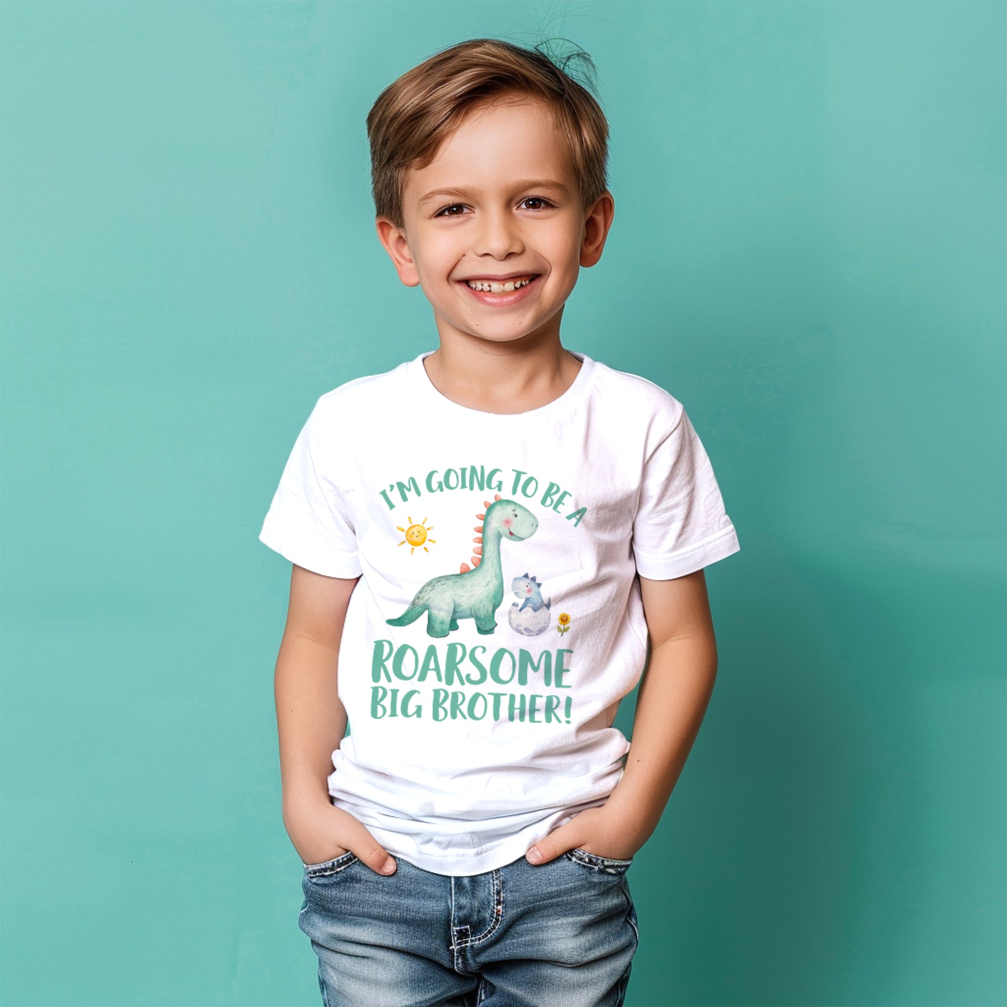 a white T-shirt featuring a playful message, "I'M GOING TO BE A ROARSOME BIG BROTHER!" with fun illustrations of a green dinosaur  Trendy Tykes