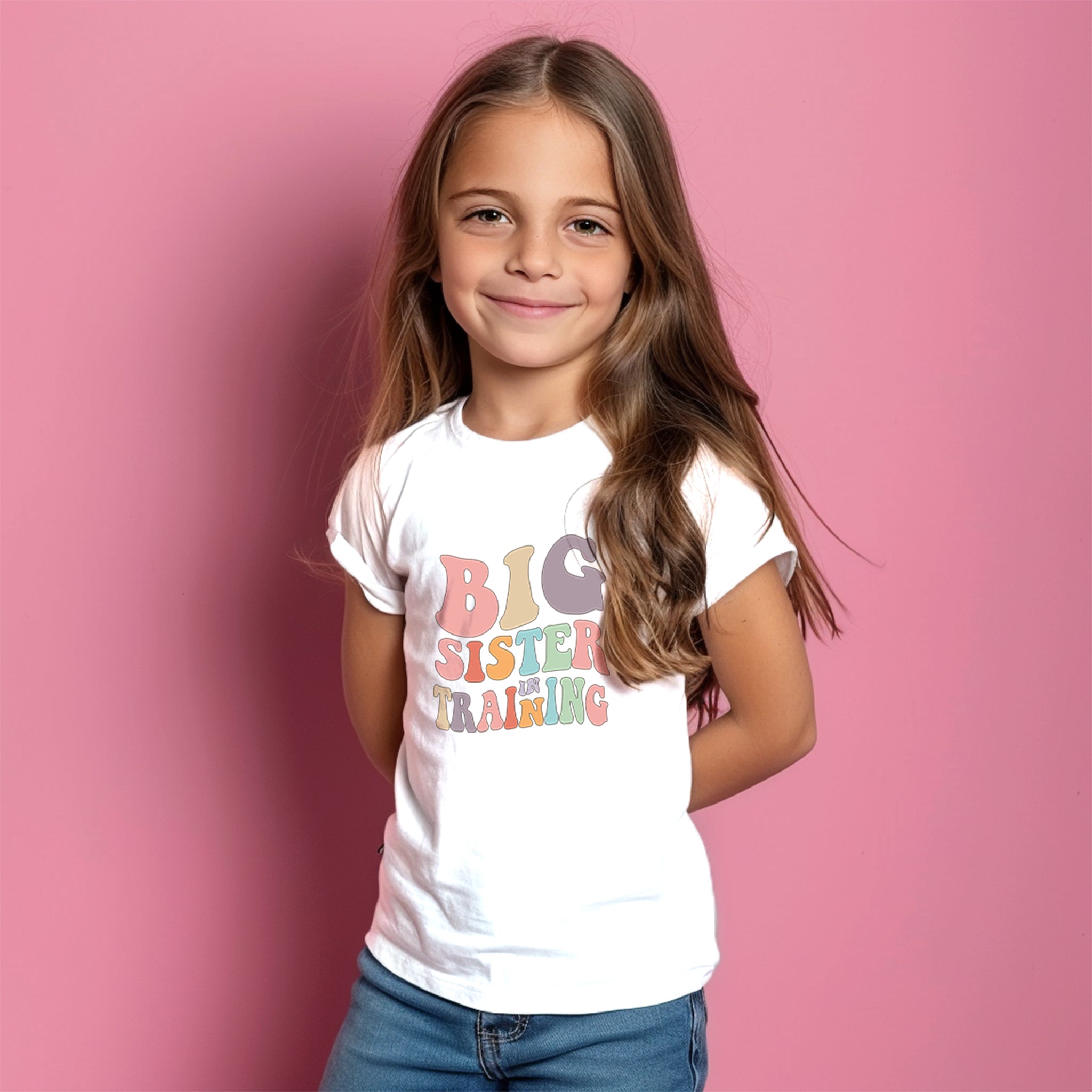 Trendy Tykes  t-shirt has a playful and heartwarming message perfect for a young girl who's about to become a big sister. It reads "BIG SISTER IN TRAINING