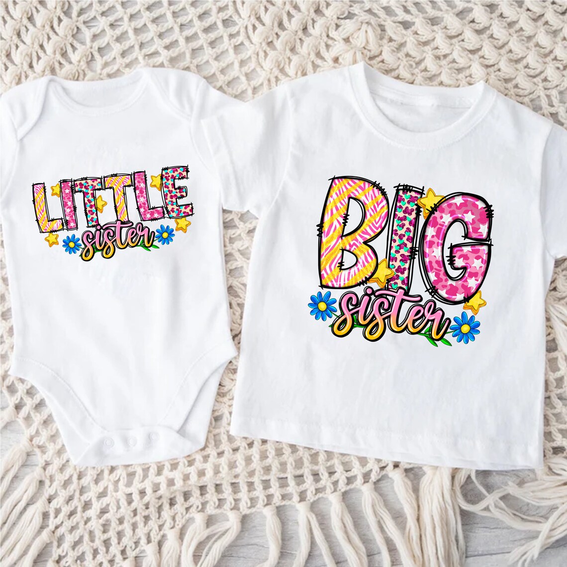 Trendy Tykes White 'Little Sister' baby onesie and 'Big Sister' t-shirt with vibrant, colorful lettering and floral designs.